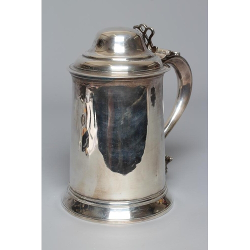 216 - A GEORGE III TANKARD by John Denzilow, London 1776, of tapering cylindrical form on a spreading foot... 