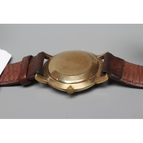 265 - A GENTLEMAN'S 9CT GOLD OMEGA WRISTWATCH, the champagne dial with applied gilt batons, quarter Arabic... 