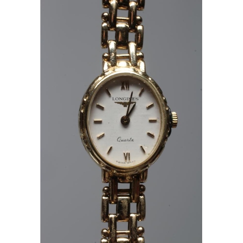 275 - A LADY'S LONGINES WRISTWATCH, stamped 375, the oval white dial with gilt metal batons, the quartz mo... 