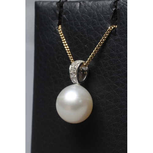 283 - A PEARL PENDANT, the white cultured pearl peg set to an 18ct white gold fixed bale point set with el... 