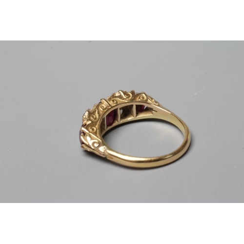 288 - A LATE VICTORIAN THREE STONE RUBY RING, the graduated circular facet cut stones claw set with four r... 