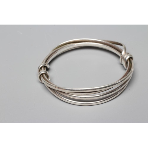 300 - A SILVER TWIST BANGLE AND MATCHING RING possibly by Jordan Cliffe, unmarked (Est. plus 24% premium i... 