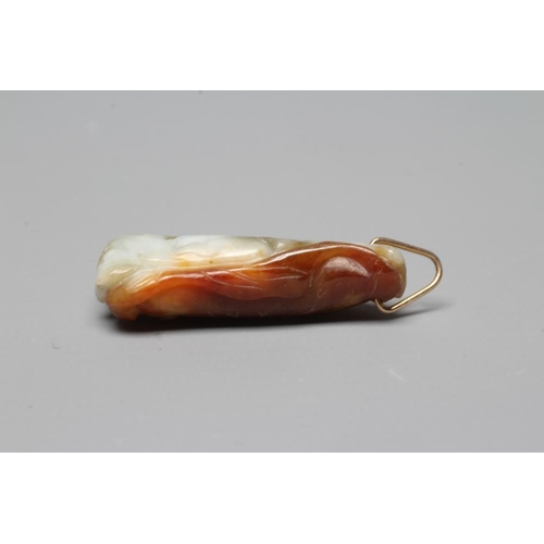 302 - A CHINESE JADE PENDANT, one side carved as a hare (?) beside a flower, the other with a persimmon, u... 