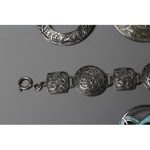 306 - A COLLECTION OF SCOTTISH SILVER JEWELLERY comprising a John Hart Iona Graham clan badge, a Claymore ... 