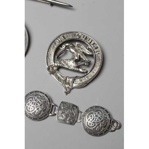 306 - A COLLECTION OF SCOTTISH SILVER JEWELLERY comprising a John Hart Iona Graham clan badge, a Claymore ... 