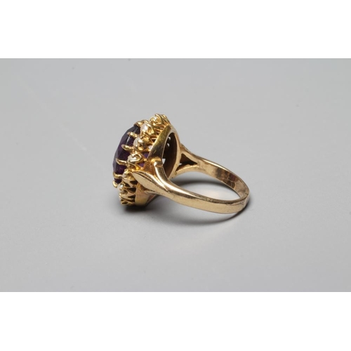 322 - AN AMETHYST AND SEED PEARL RING, the oval facet cut amethyst claw set to a border of fourteen seed p... 