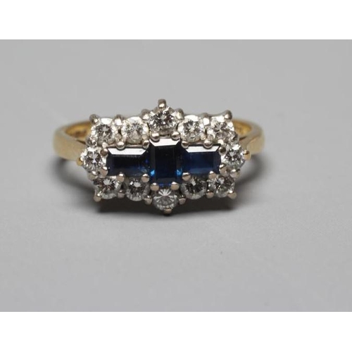 335 - A SAPPHIRE AND DIAMOND RING, the three emerald cut sapphires claw set to a border of twelve brillian... 