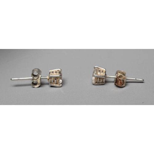 338 - A PAIR OF DIAMOND SOLITAIRE EAR STUDS, the brilliant cut stones each of approximately 0.30cts claw s... 