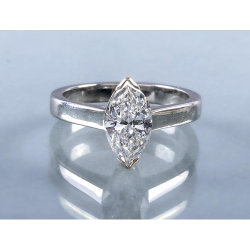 340 - A SOLITAIRE DIAMOND RING, the marquise cut stone of 1.30cts claw set to a plain unmarked platinum sh... 