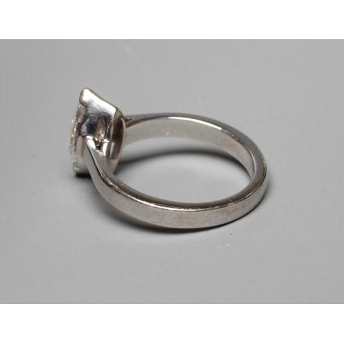 340 - A SOLITAIRE DIAMOND RING, the marquise cut stone of 1.30cts claw set to a plain unmarked platinum sh... 