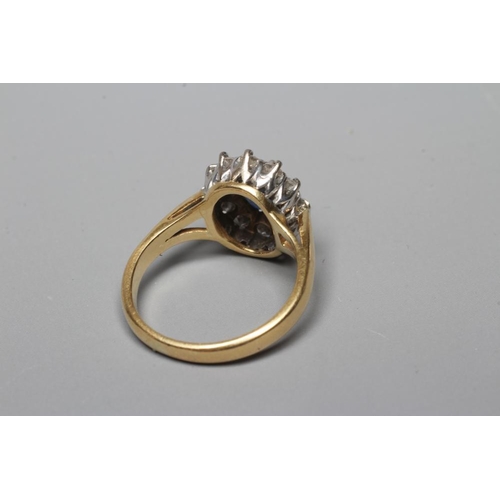 345 - A SAPPHIRE AND DIAMOND CLUSTER RING, the oval facet cut sapphire claw set to a border of twelve bril... 