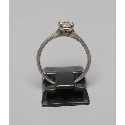 347 - A SOLITAIRE DIAMOND RING, the Princess cut stone of 0.50cts claw set to shoulders each channel set w... 