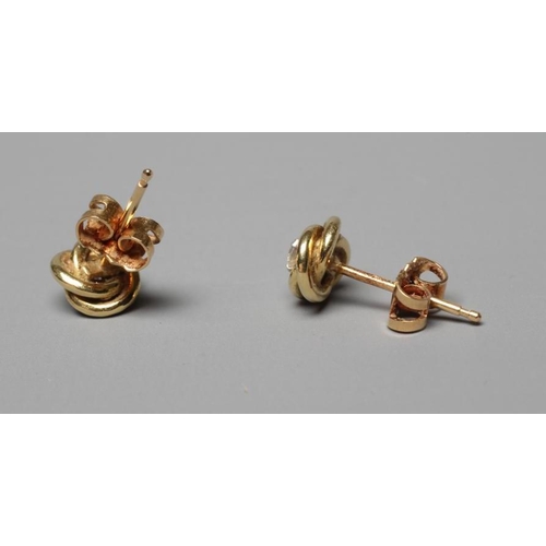 358 - A PAIR OF SOLITAIRE DIAMOND EAR STUDS, the brilliant cut stones claw set to an 18ct gold knot (Est. ... 