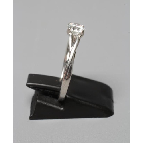 365 - A SOLITAIRE DIAMOND RING, the round brilliant cut stone of 0.50ct claw set to open shoulders and a p... 