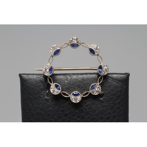 370 - A SAPPHIRE AND DIAMOND CIRCLET BROOCH, the eight roundels each set with a marquise cut sapphire and ... 