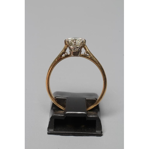 373 - A SOLITAIRE DIAMOND RING, the brilliant cut stone of approximately 0.6cts claw set to a plain unmark... 