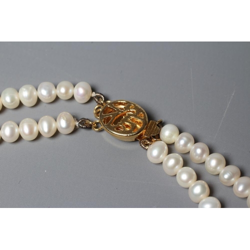 378 - A DOUBLE STRAND FRESHWATER PEARL NECKLACE with gilt metal clasp (Est. plus 24% premium inc. VAT)