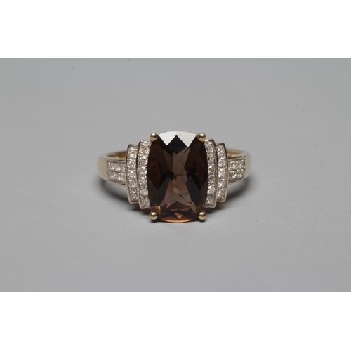 381 - A DRESS RING, the oblong facet cut smoky quartz claw set to stepped shoulders point set with numerou... 