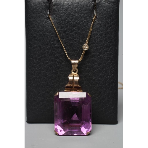 383 - AN AMETHYST PENDANT, the oblong facet cut stone claw set to a plain unmarked frame with hinged bale,... 