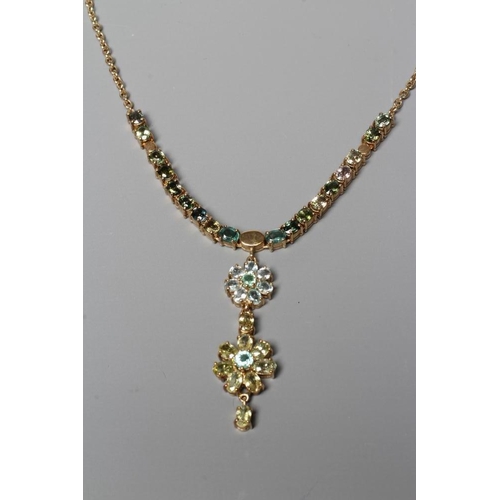 391 - A TOURMALINE FLOWERHEAD NECKLACE, the two mixed colour graduated flowerhead pendants hanging from a ... 