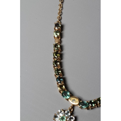 391 - A TOURMALINE FLOWERHEAD NECKLACE, the two mixed colour graduated flowerhead pendants hanging from a ... 