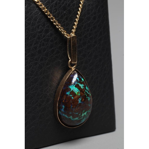 394 - AN OPAL PENDANT, the pear cut cabochon 'boulder' stone in a plain close back mount with plain bale, ... 