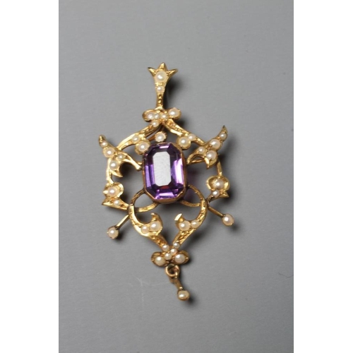 403 - AN EDWARDIAN AMETHYST AND SEED PEARL PENDANT of typical open shield form centred by a step cut ameth... 