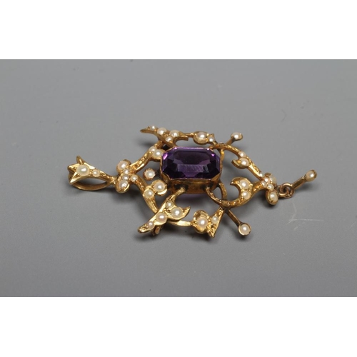 403 - AN EDWARDIAN AMETHYST AND SEED PEARL PENDANT of typical open shield form centred by a step cut ameth... 