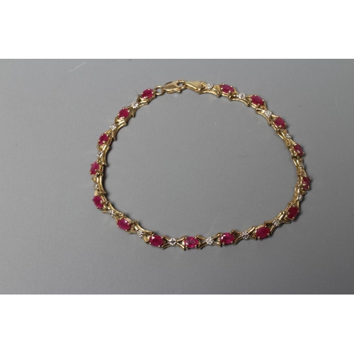 404 - A RUBY AND DIAMOND BRACELET, the sixteen oval facet cut rubies claw set with X links between, and ea... 