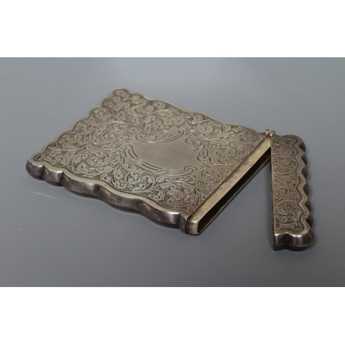 98 - A LATE VICTORIAN SILVER VISITING CARD CASE by William M. Hayes, Birmingham 1897, of shaped oblong fo... 