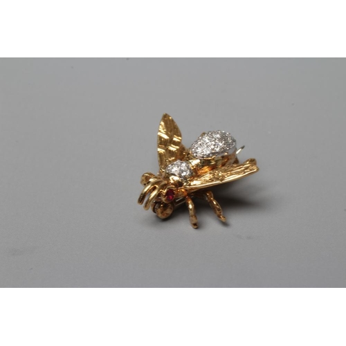 290 - AN 18CT GOLD NOVELTY INSECT BROOCH set with two facet cut ruby eyes and with pave set diamonds to th... 