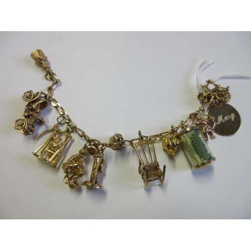 239 - 9CT GOLD CHARM BRACELET WITH TWELVE 9CT GOLD CHARMS 38g GROSS