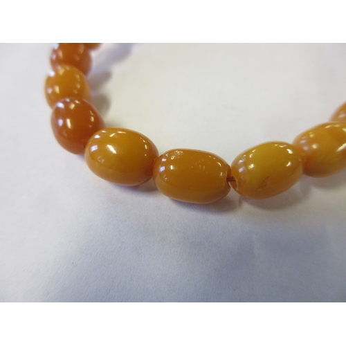 271 - TWO AMBER COLOURED BEAD NECKLACES