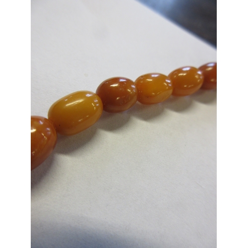 271 - TWO AMBER COLOURED BEAD NECKLACES