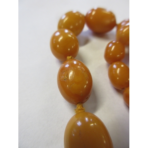 271 - TWO AMBER COLOURED BEAD NECKLACES