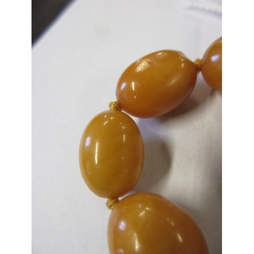 271 - TWO AMBER COLOURED BEAD NECKLACES