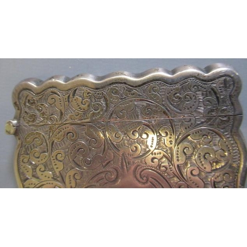 98 - A LATE VICTORIAN SILVER VISITING CARD CASE by William M. Hayes, Birmingham 1897, of shaped oblong fo... 