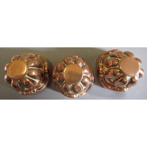 411 - TWO SETS OF THREE SMALL VICTORIAN COPPER JELLY MOULDS of fluted tapering cylindrical form, one set s... 