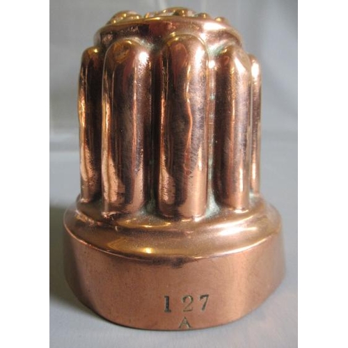 411 - TWO SETS OF THREE SMALL VICTORIAN COPPER JELLY MOULDS of fluted tapering cylindrical form, one set s... 