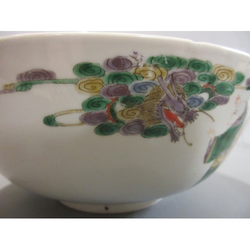 1 - A CHINESE PORCELAIN FAMILLE VERTE BOWL of plain circular form painted with a seated Hotei with seven... 