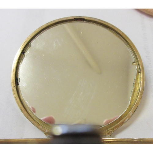 115 - A CARTIER ART DECO 9CT GOLD CIRCULAR COMPACT, London 1945, the concentric circle engine turned cover... 