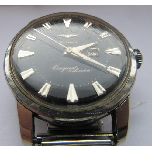 264 - A GENTLEMAN'S LONGINES AUTOMATIC CONQUEST CALENDAR WRISTWATCH, the black dial with applied silvered ... 