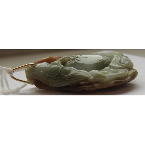 302 - A CHINESE JADE PENDANT, one side carved as a hare (?) beside a flower, the other with a persimmon, u... 