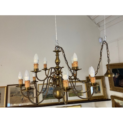 687 - AN IMPRESSIVE BRASS DUTCH STYLE CHANDELIER, 20th century, the baluster stem issuing thirty-six light... 