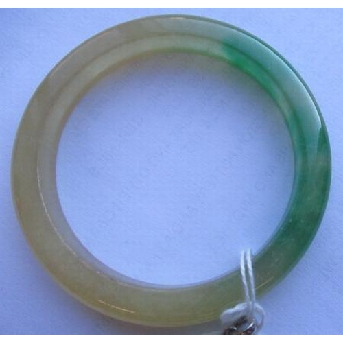 304 - A CHINESE POLISHED JADE BANGLE of D form, 37g, together with a silver mounted jade Shou pendant, sta... 