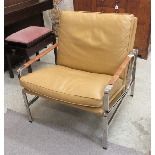 644 - A PAIR OF LEATHER AND CHROME FRAMED ARMCHAIRS, modern, the loose, tan cushions on a square section f... 