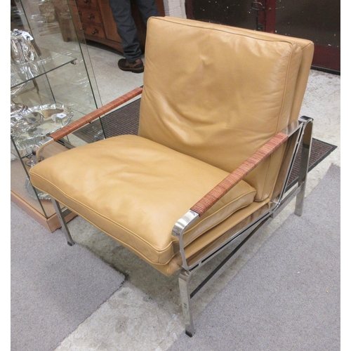 644 - A PAIR OF LEATHER AND CHROME FRAMED ARMCHAIRS, modern, the loose, tan cushions on a square section f... 