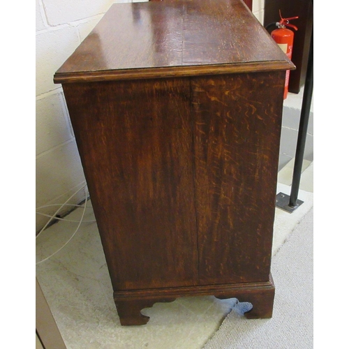 670 - A GEORGIAN OAK STRAIGHT FRONT CHEST, early 19th century, the moulded edged top over two short and th... 