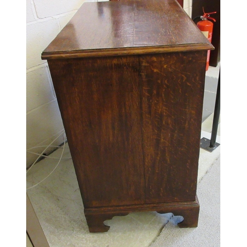 670 - A GEORGIAN OAK STRAIGHT FRONT CHEST, early 19th century, the moulded edged top over two short and th... 