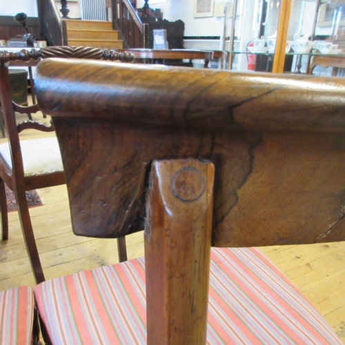 709 - A SET OF SIX EARLY VICTORIAN ROSEWOOD DINING CHAIRS, mid 19th century, the open back with curved top... 